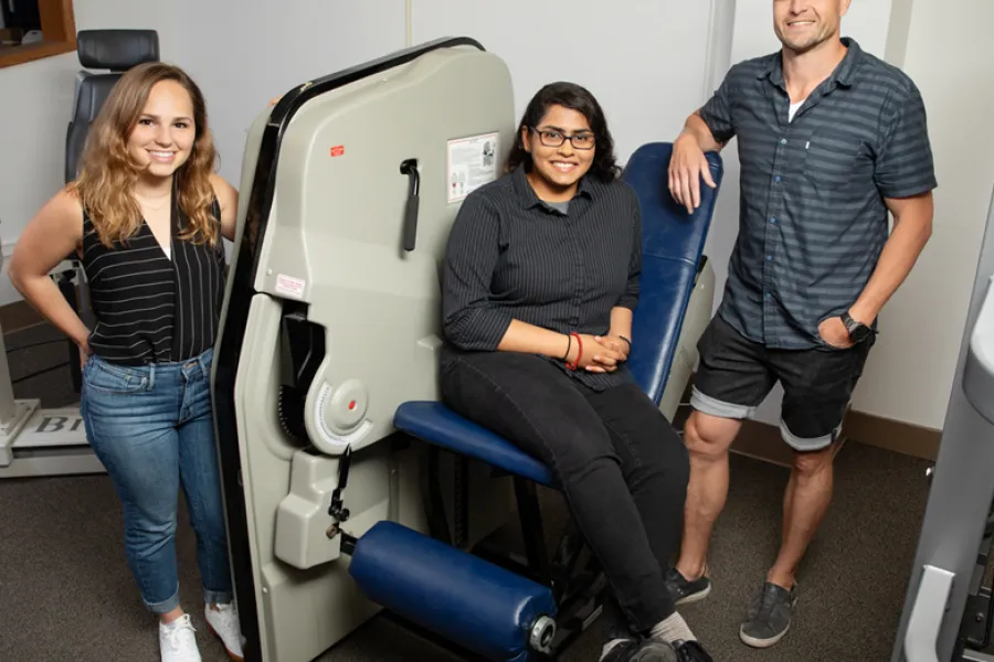 A team including, from left, doctoral student Colleen McKenna, undergraduate student Elizabeth Poozhikunnel and  kinesiology and community health professor Nicholas Burd found that post-workout muscle building and repair is blunted in adults with obesity. 