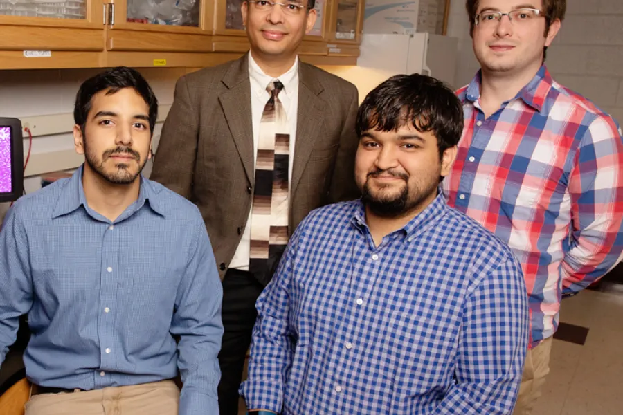 Biochemistry professor Auinash Kalsotra, second from left, and his team, including, from left, graduate students Waqar Arif, Joseph Seimetz and Sushant Bangru, uncovered the molecular underpinnings of liver regeneration. 