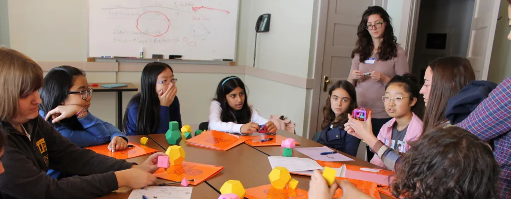 previous recipient, Michelle Delcourt, teaching math to young girls