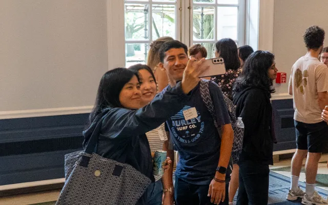 a group of new students taking a selfie