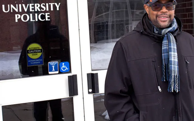 Dementro Powell stands in front of the U. of I. Public Safety Building on Feb. 17, 2021.