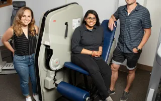 A team including, from left, doctoral student Colleen McKenna, undergraduate student Elizabeth Poozhikunnel and  kinesiology and community health professor Nicholas Burd found that post-workout muscle building and repair is blunted in adults with obesity. 