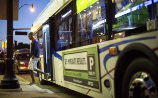 Student getting off of an MTD bus