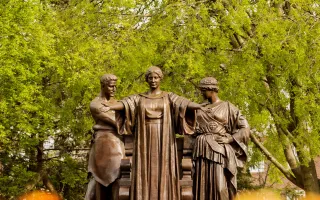 Alma Mater statue in springtime.