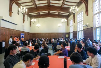 A wide shot of students listening to a panel